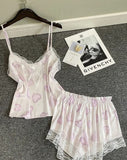 Two-piece pajama set made of satin with lace around the edges