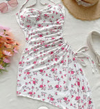 House dress made of floral cotton with a ruffle tie on one side