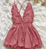 Jumpsuit made of satin with ruffles around the chest