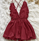 Jumpsuit made of satin with ruffles around the chest