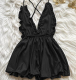 Jumpsuit made of satin with ruffles around the chest