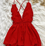 Jumpsuit made of satin with ruffles around the chest