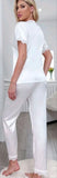 Two-piece satin pajama - with lace around the neck, sleeves, and the end of the pants